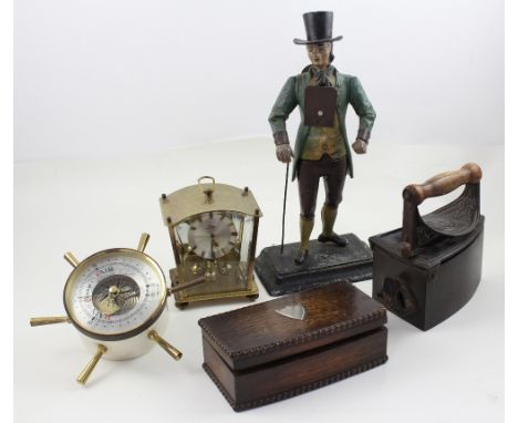 A mixed lot to include an aneroid barometer modelled as a ship's wheel, a cast iron advertising figure modelled as a gentleme