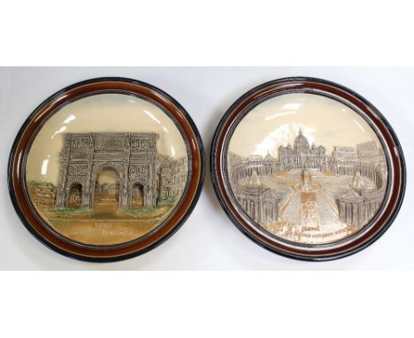 A pair of Roman souvenir plates with relief ceramic decoration, one featuring St Peter's Square and Basilica, the other the A
