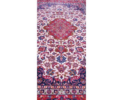 An antique Persian hand-made Isfahan carpet, 360 x 237cm.