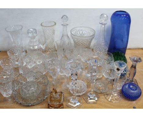 A quantity of cut glass, crystal and other glassware to include decanters, wine glasses, a Bohemian candlestick and a large b