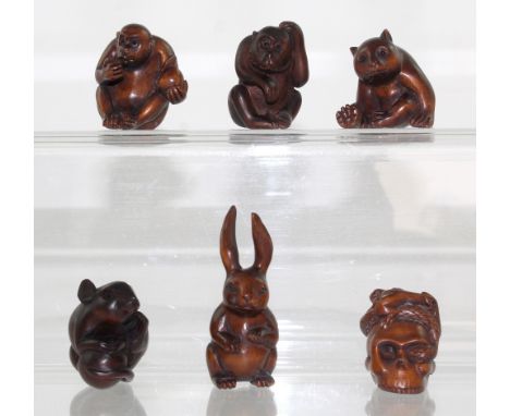 Six boxwood netsuke to include two monkeys, a bear, a rat, a rabbit and a snake eating a toad wrapped around a skull, height 