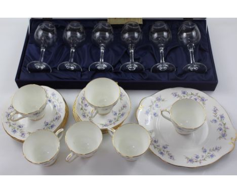 A set of six Italian engraved wine glasses and a vintage tea service with blue floral decoration (2).