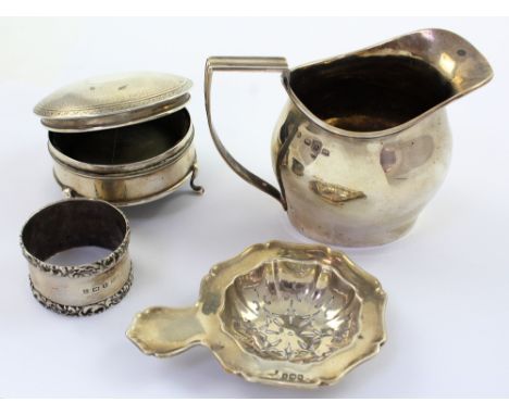 A small collection of Victorian and later silver to include a George V hallmarked silver tea strainer, Walker &amp; Hall, She