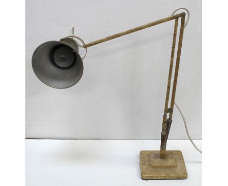 A vintage Anglepoise-style lamp.