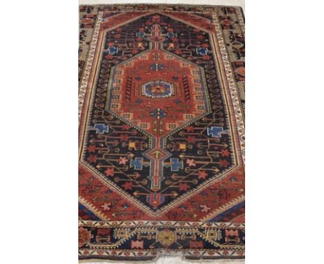 An antique Persian hand-made Brojerd carpet, 226 x 150cm.