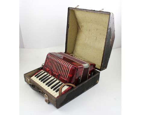 A cased Bell accordion.