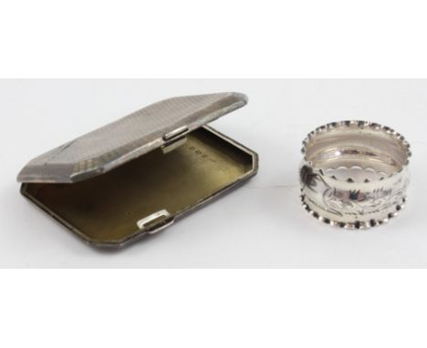 A George V hallmarked silver engine-turned octagonal cigarette case, Birmingham 1921, width 9cm and a hallmarked silver napki