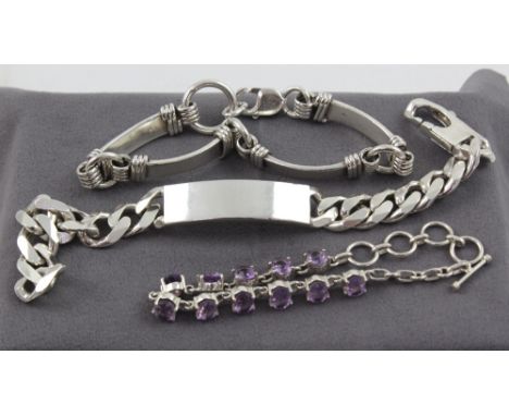 Three silver bracelets, one horse bit in the style of Gucci, one set with amethyst-coloured stones and an identity bracelet, 