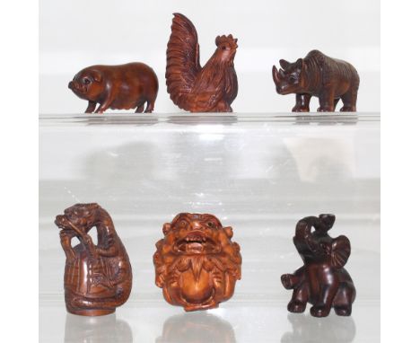 Six boxwood netsuke to include a rhinoceros, cockerel, elephant, pig, dragon and Kylin, height 5cm (6).