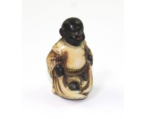 A 19th century European porcelain copy of an 18th century Japanese Negoro netsuke modelled as an Oriental gentleman and child