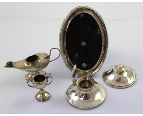 A George V hallmarked silver capstan inkwell, S Blanckensee &amp; Son Ltd, Birmingham 1928, a silver-backed purse mirror, a s