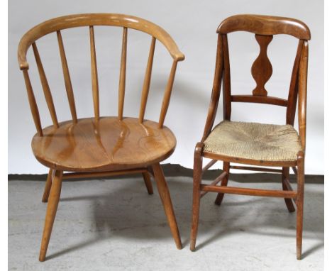 An Ercol stick-back captain's-style chair (with modified legs) and a children's country-style dining chair with rush seat (2)