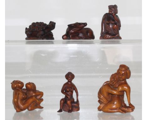A collection of six boxwood netsuke to include two erotic examples, a seated female nude, a tortoise, a water buffalo and a f