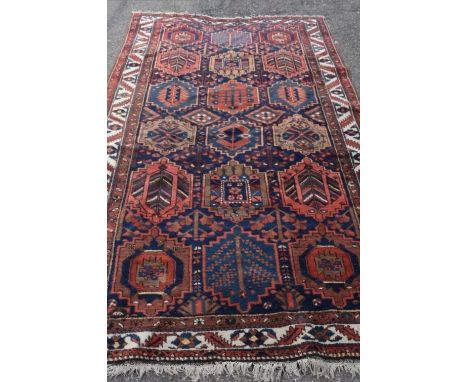 An antique Persian hand-made Bakhtiar carpet, 301 x 155cm.