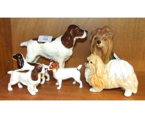 A collection of four Beswick dogs, including: Cocker Spaniel "Horseshoe Primula", liver and white, Jack Russell Terrier - sma