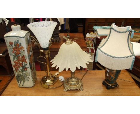 An Oriental ceramic table lamp, one other and two brass table lamps, (4).