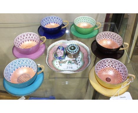 Two sets of three each Steinbock Email Austrian enamel demitasse cups and saucers with rattan weave over the handles and thre