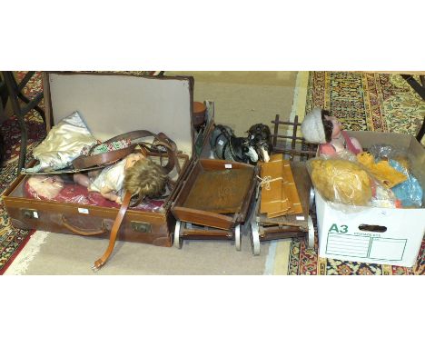 A mohair teddy bear, a Sooty glove puppet, three composite dolls, two wooden models of agricultural carts and other items.