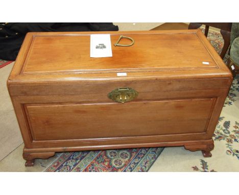 A 20th century Hong Kong camphor-wood-lined hardwood chest on short bracket feet, 93cm wide and an Oriental carved standard l