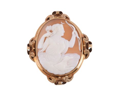  A Victorian shell cameo brooch,   circa 1880, the oval panel carved with the relief of Diana with bow in hand after releasin