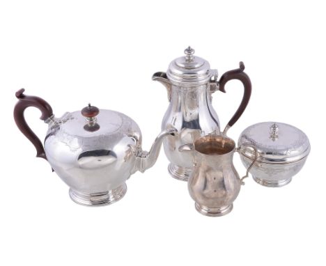  A silver three piece circular tea service by The Goldsmiths  &  Silversmiths Co. Ltd.,   London 1927, the tea pot with a woo