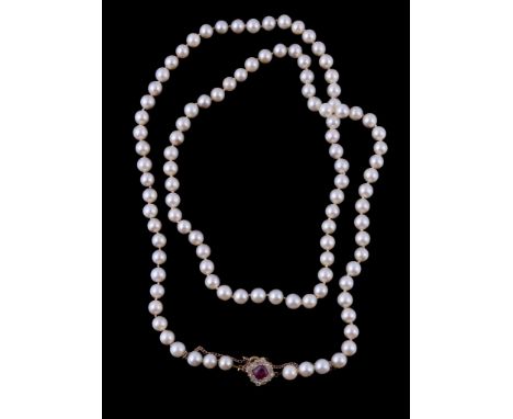  A cultured pearl necklace with ruby and diamond clasp,   the one hundred and four uniform cultured pearls measuring 6.1mm di