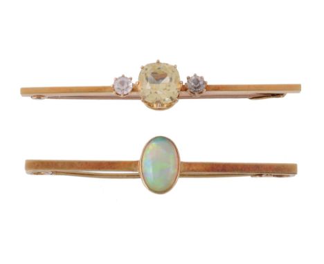  An Edwardian opal brooch,   the oval cabochon opal in a collet setting, on a polished bar, stamped 15ct, 4.7cm wide; togethe