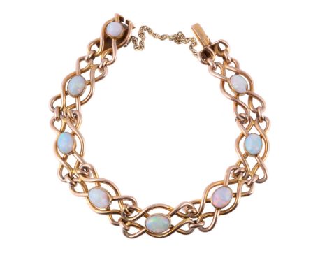  An Edwardian gold and opal bracelet,   the oval cabochon opals on a polished looped link bracelet, to a concealed clasp, sta