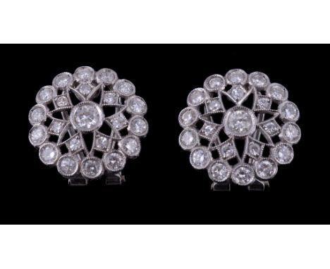  A pair of diamond cluster earrings,   the pierced circular panels set with brilliant cut diamonds and eight cut diamonds, ap