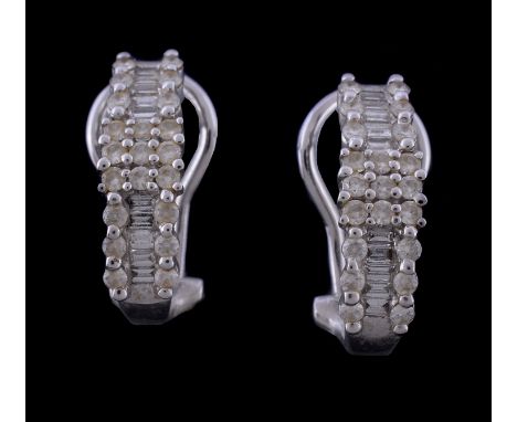  A pair of diamond earrings,   the slightly curved panels set with brilliant cut and baguette cut diamonds, approximately 1.0