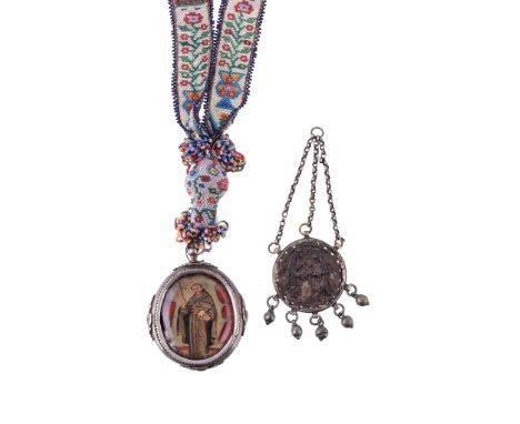  A Spanish or Spanish colonial oval double sided devotional pendant,   inset with a full length portrait of a monk saint, pos