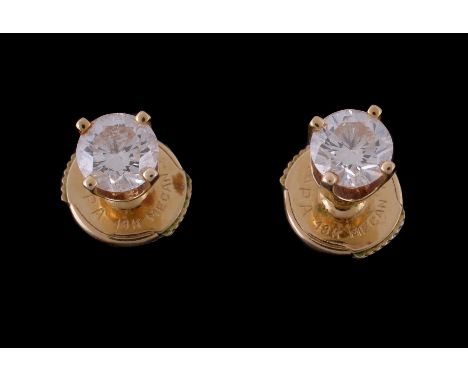  A pair of diamond ear studs,   the brilliant cut diamonds, estimated to weigh 0.72 carats total, with post fittings, stamped