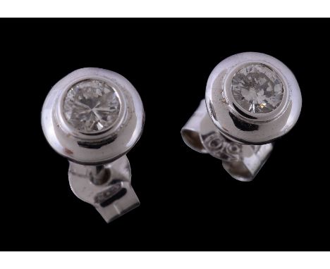  A pair of diamond ear studs,   the brilliant cut diamonds, approximately 0.26 carats total, with post fittings, stamped 750 