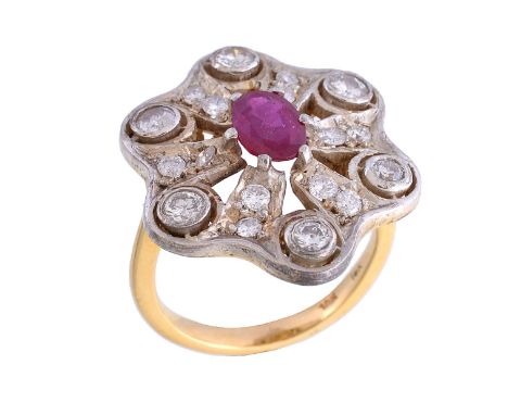  A ruby and diamond cluster ring,   the oval cut ruby within a surround of brilliant cut diamonds, approximately 0.95 carats 