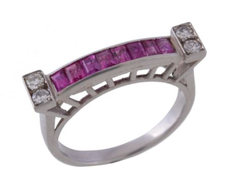  A 1940s ruby and diamond ring,   the panel of rectangular cut rubies channel set between eight cut diamond shoulders, finger
