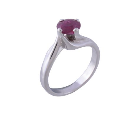  A ruby single stone ring,   the oval cut ruby in a four claw setting, stamped 750 with Italian control marks, finger size N 