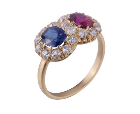  A late Victorian ruby, sapphire and diamond double cluster ring,   circa 1900, the oval cut ruby and oval cut sapphire each 