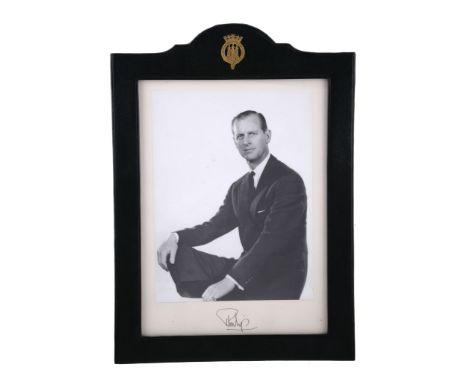  HRH Prince Philip (b. 1921), Duke of Edinburgh,  a signed 7 3/4in x 5 3/4in photograph,   of the Prince seated in a formal t