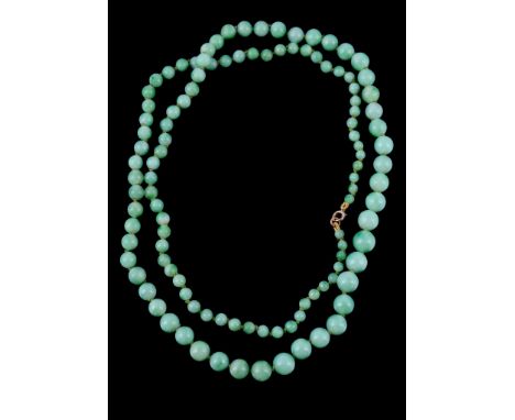  A jadeite jade bead necklace,   the graduating circular jadeite jade beads on a knotted string, 83cm long, 61g 