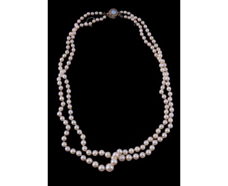  A two row cultured pearl necklace,   the two rows of graduating cultured pearls on a knotted string, to an early 20th centur