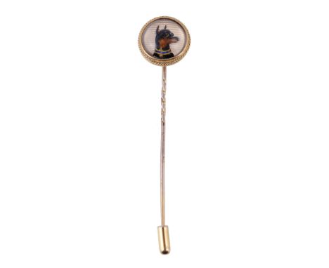  A reverse crystal intaglio Manchester Terrier stick pin,   the circular panel carved and painted with the head of a Manchest
