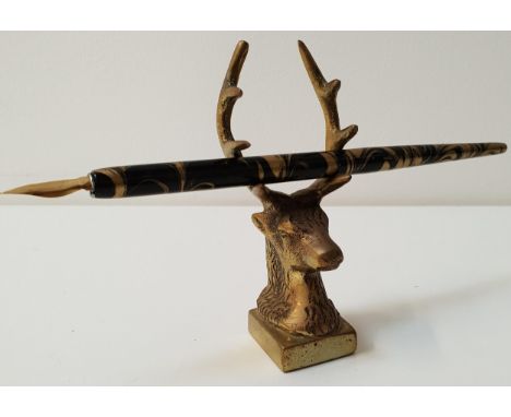 BRASS STAGS HEAD PEN HOLDERon a square base, the antlers providing space for three pens, 10.5cm high, together with a vintage