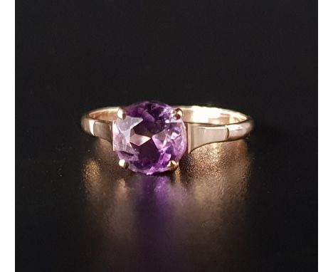 AMETHYST SINGLE STONE RINGthe round cut amethyst approximately 1.5cts, on nine carat gold shank, ring size P 