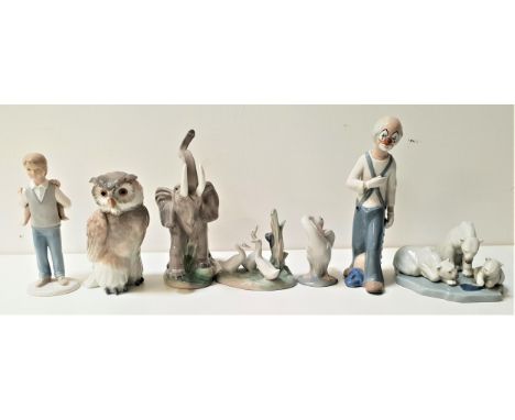 LLADRO FIGURINESincluding a goose preening itself, 10.5cm high and a polar bear group, 15cm wide, a Nao group of three geese,