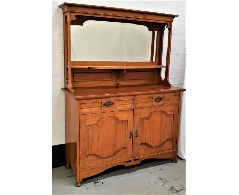 ARTS AND CRAFTS LIGHT OAK SIDEBOARDwith a shaped bevelled mirror back above a shaped shelf, the base with two panelled drawer