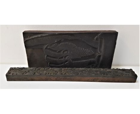 TWO VINTAGE METAL PRINTING BLOCKSone depicting holly and mistletoe, 35.5cm long, the other a hand with a pointing finger, 26c