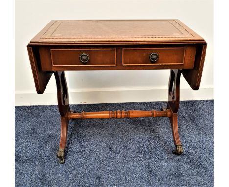 SMALL YEW SOFA TABLEwith an inset tooled leather top above two panelled frieze drawers with two opposing dummy drawers, stand