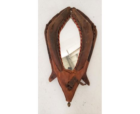 VINTAGE LEATHER HORSE COLLARwith original metal fixings, now fitted with a decorative shaped mirror plate, 90cm high 