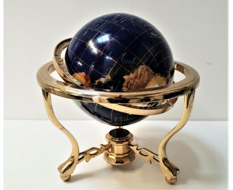 TABLE TOP TERRESTRIAL GLOBEwith a brass frame and specimen stone globe, the base with an inset compass, 33cm high 