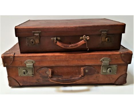 VINTAGE LEATHER SUITCASEwith reinforced corners, brass locks and leather carry handle, 18cm x 62cm , together with a smaller 